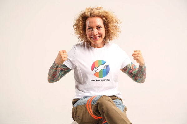 Sofia Wellman - Love More Fight Less Rainbow Hand-in-Hand Shirt